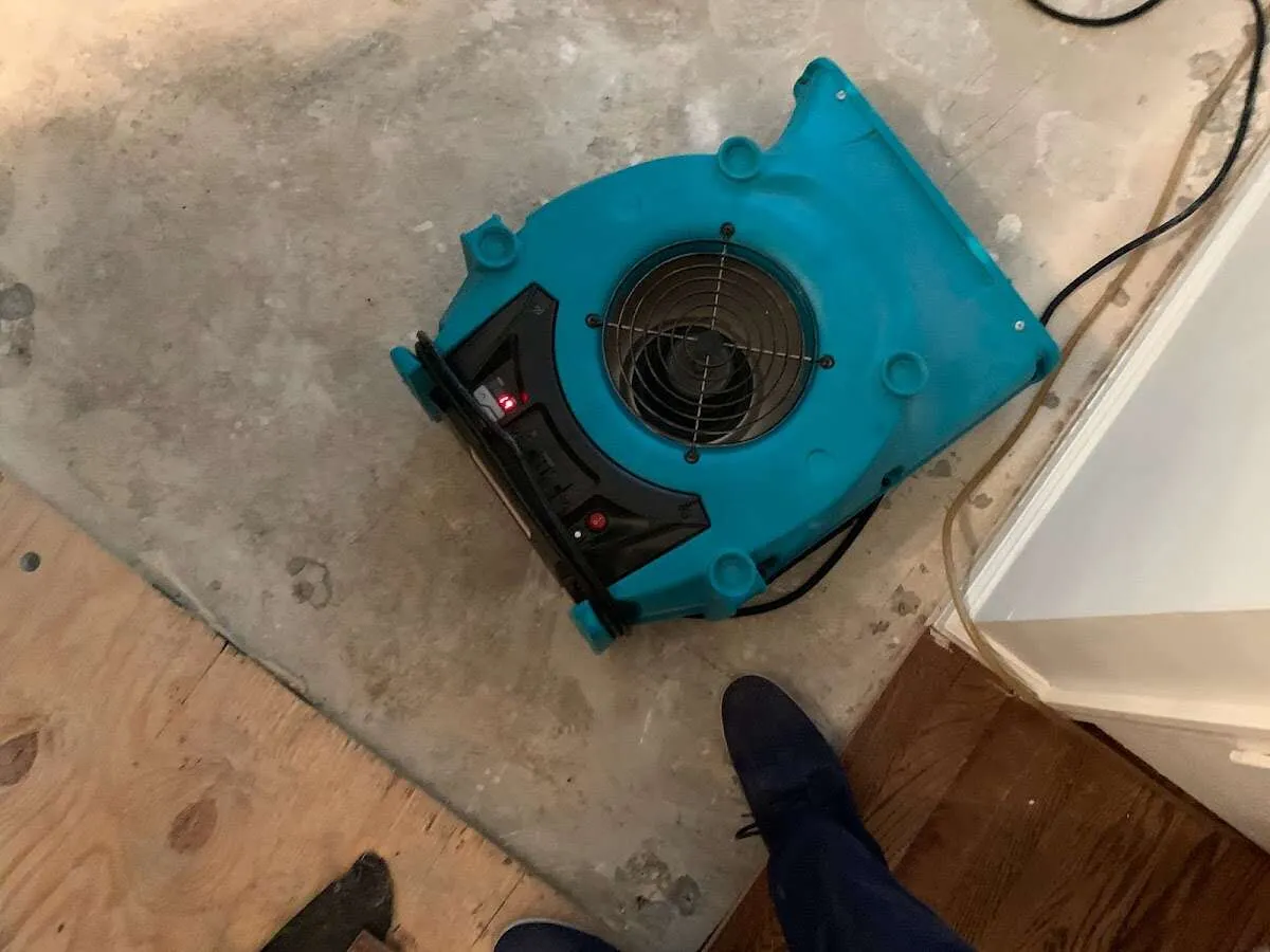 Air mover drying subfloor during Leak Detection & Repair in Elizabethtown